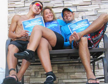 Three future dolphin trainers show off their ABC Dolphin Training certificates