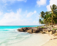 Tropical islands with breathtaking views of crystal blue water and palm trees sit off the Yucatan Peninsula